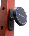 Black magnetic phone holder attached to a wooden surface with 'Blaubeck' branding.