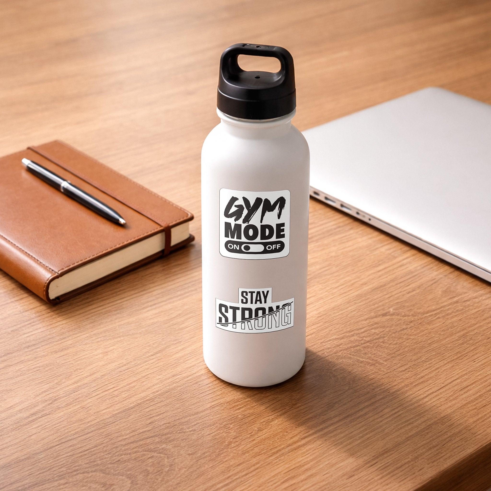 Gym Mode On Off and Stay Strong stickers from the BLAUBECK 45-pack on a white reusable water bottle